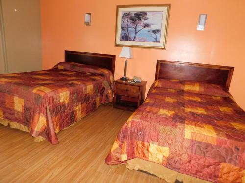 Een bed of bedden in een kamer bij Hotel Vicenza