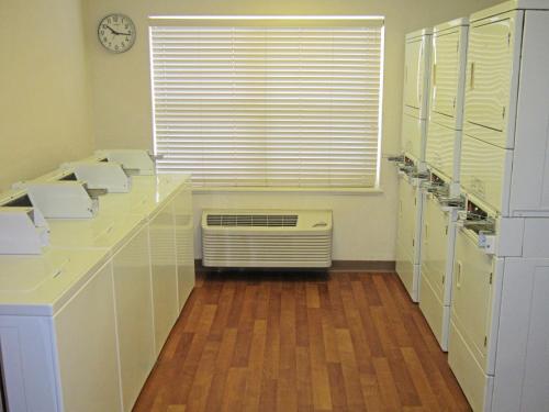 a room with a kitchen with a radiator and a window at Extended Stay America Suites - Orlando - Convention Center - 6443 Westwood in Orlando
