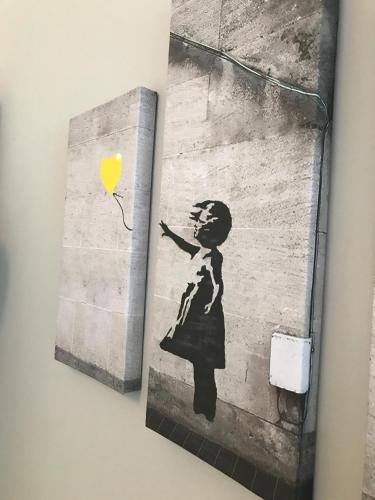 a book with a picture of a girl with a balloon at The Castle Lodge in Tredegar