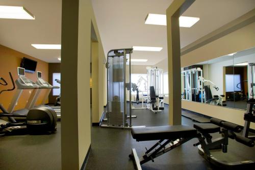 a gym with several treadmills and mirrors at Radisson Hotel Portland Airport in Portland