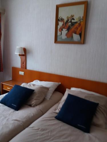Postel nebo postele na pokoji v ubytování Hotel 'T Hert