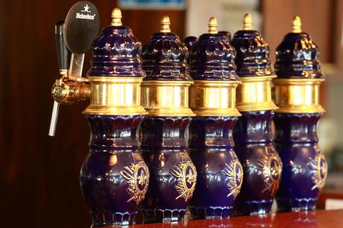 a group of blue and gold vases on a table at Eurotel Parc Expo Airport Montpellier in Pérols