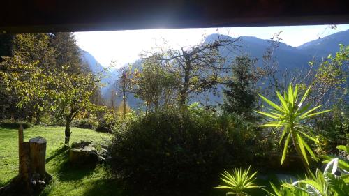 a view of a mountain range from a window at Luxus Chalet Mühlermoos in Ramsau im Zillertal