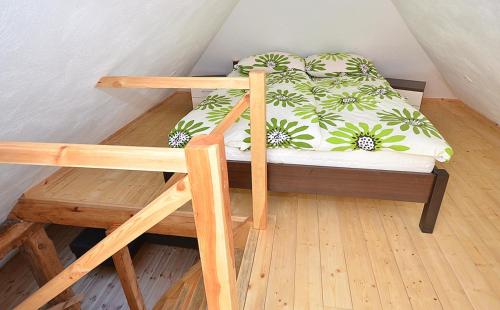 a bunk bed in a room with a bed with a pillow at Nad morzem i jeziorem Dworek Kopań in Kopań