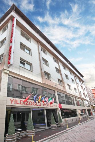 a building with a sign on the front of it at Yildizoglu Hotel in Samsun