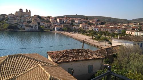 a view of a town with a river and houses at Galaxa Mansion in Galaxidhion