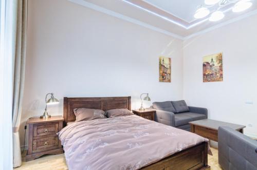 Кровать или кровати в номере Apartment Grebinky 9