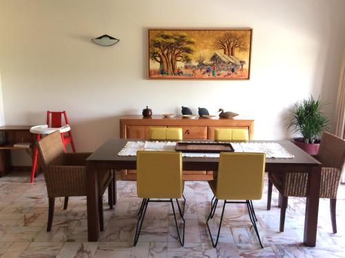 a dining room with a table and chairs at Apartamento Praia Azul in Vila do Conde