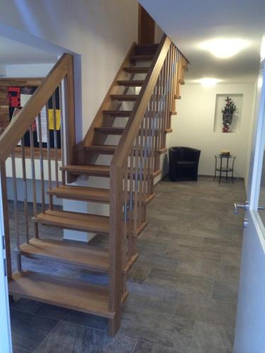 a staircase in a home with wood treads at Haus Berner in Filzmoos