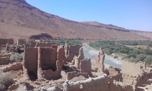 an old castle on the side of a river at Luna del fuego in Ifri