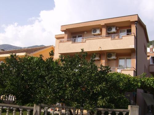 a building with ac units on the side of it at Guesthouse Lautasevic in Petrovac na Moru