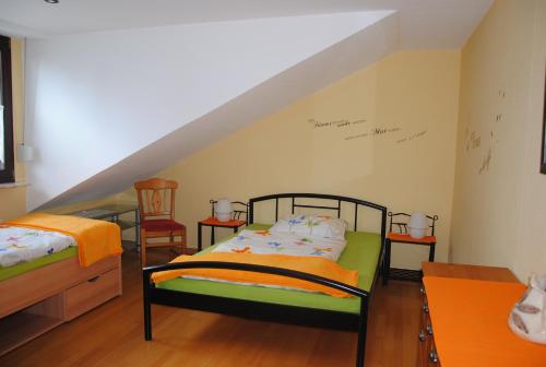Ferienwohnung Rosengarten tesisinde bir odada yatak veya yataklar