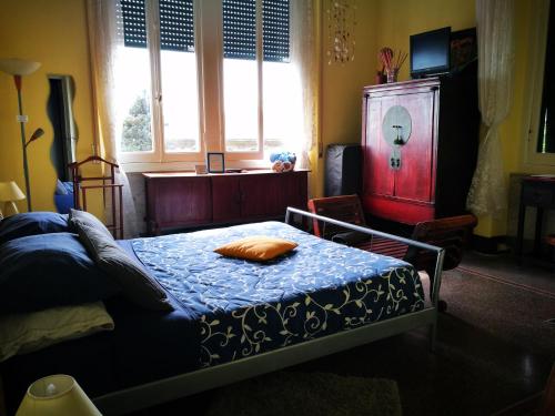 a bedroom with a bed with a pillow on it at L'Andirivieni in Camogli