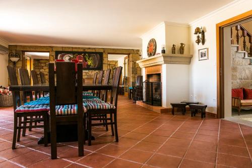 
a living room filled with furniture and a fireplace at Casa da Fidalga - Villa of 5 bedrooms in Outeiro de Gatos
