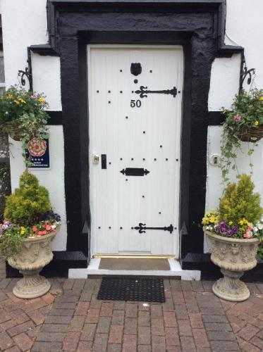 a white door with the number on it at The Old Coach House in Blackpool