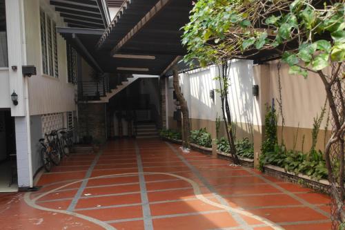 a hallway of a building with a red brick floor at New Manila Suites in Manila