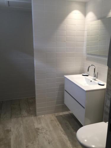 a bathroom with a sink and a toilet at Stella Maris in Hyères