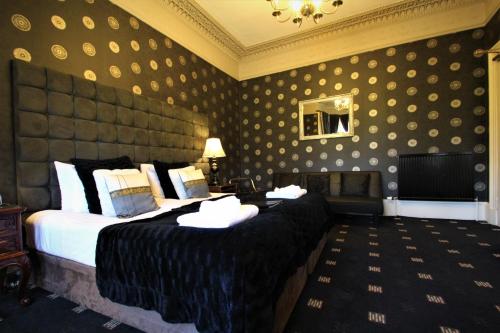a hotel room with a bed and a desk at The Sandaig in Edinburgh