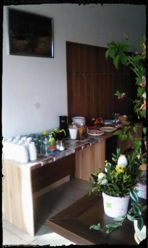 a kitchen with a counter with food on it at Rekreační a školicí středisko Zájezek in Chlum u Třeboně