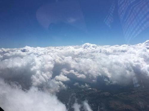a view of the clouds from an airplane at Hotel Sperling mit E-Ladestation in Speyer