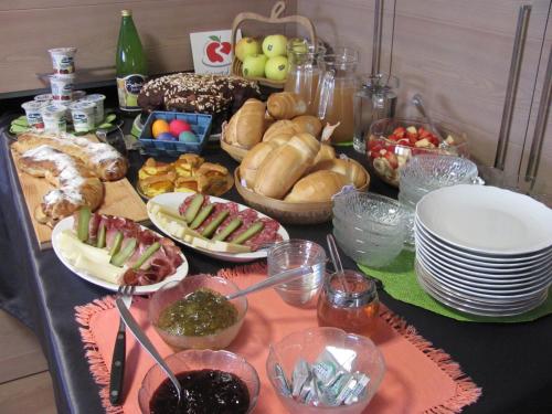 a table topped with lots of different types of food at NonSoloMele in Romallo