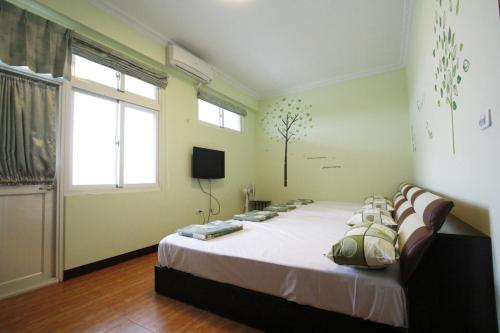 Postel nebo postele na pokoji v ubytování 驫風民宿 Equuleus Homestay