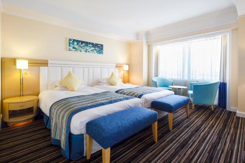 Cama o camas de una habitación en Dai-ichi Hotel Tokyo Seafort