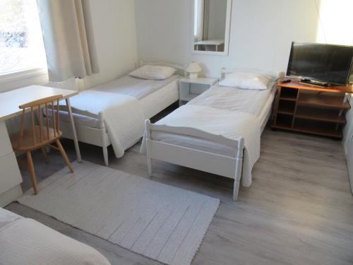 Un pat sau paturi într-o cameră la Ruska Bed & Breakfast