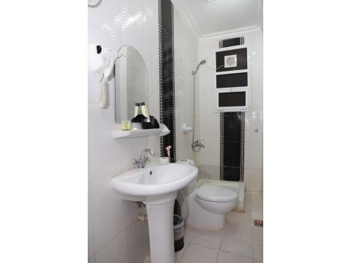 Ванна кімната в Al Hussam Hotel Apartments