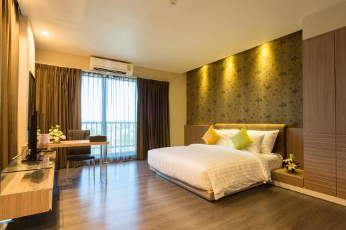En eller flere senger på et rom på Tonaoi Grand Hotel