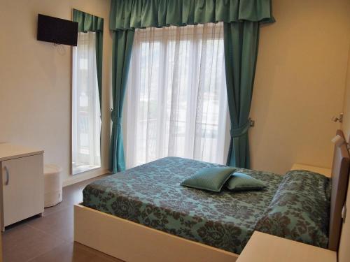Postel nebo postele na pokoji v ubytování Endro's Rooms