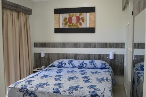 A bed or beds in a room at Reserve Caldas Lacqua 5