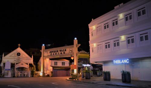 a street with a sign in front of a building at TheBlanc Boutique Hotel in Melaka
