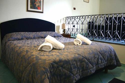 Łóżko lub łóżka w pokoju w obiekcie Villa Bikini on Sorrento Coast