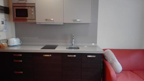 A kitchen or kitchenette at Apartamentos Santana