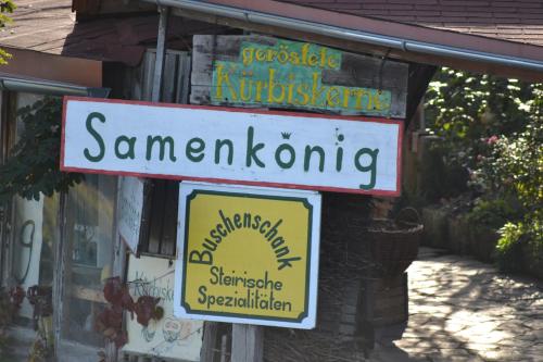 a sign for a santander restaurant on a building at Samenkönig Pschait Handels GmbH in Gamlitz