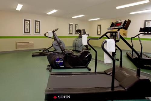 a gym with two elliptical machines and a treadmill at Extended Stay America Suites - Philadelphia - Airport - Bartram Ave in Philadelphia