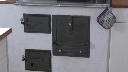 two black doors on a white wall at Villa Casa in Bad Tölz