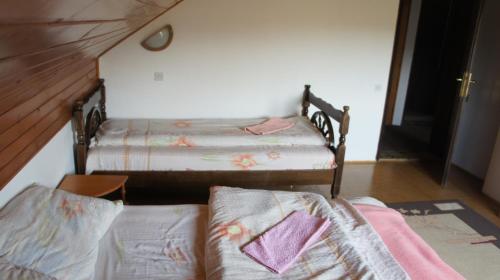 Кровать или кровати в номере Apartment Gajevi