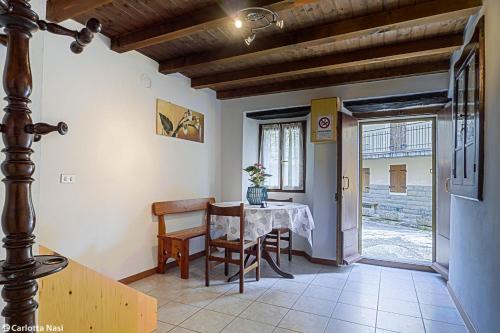 a dining room with a table and a window at La Calla in Monghidoro