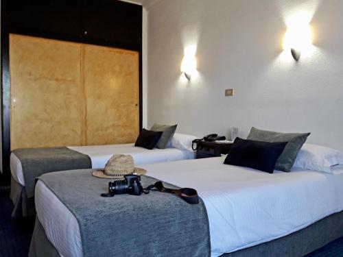 Postelja oz. postelje v sobi nastanitve Hotel Miramar