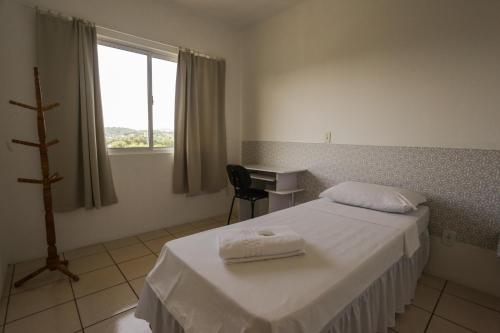 Een bed of bedden in een kamer bij Hotel Norte Blu
