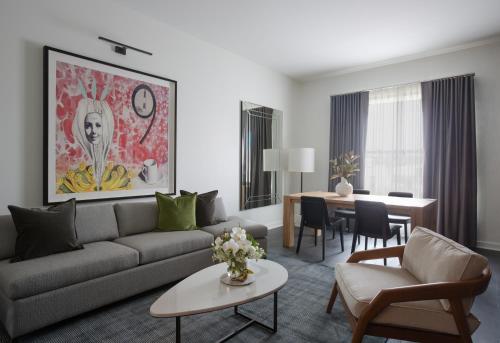 a living room with a couch and a table at Andaz San Diego, By Hyatt in San Diego