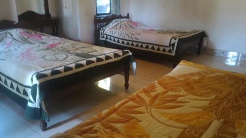 Cama o camas de una habitación en Sunarta House Homestay