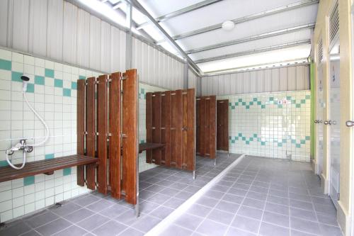 a row of lockers in a bathroom at Magnni Villa in Nanzhuang
