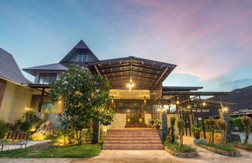 a house with a staircase in front of it at Krabi Home Town Boutique in Krabi town