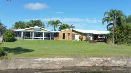 a house with a large yard in front of it at Hilltop Hideaway in Ninderry