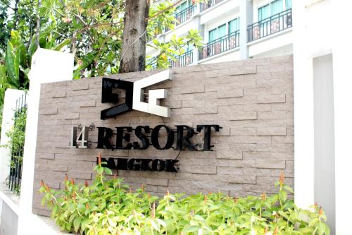 a sign for the resort lobby in front of a building at 14 Resort in Bangkok