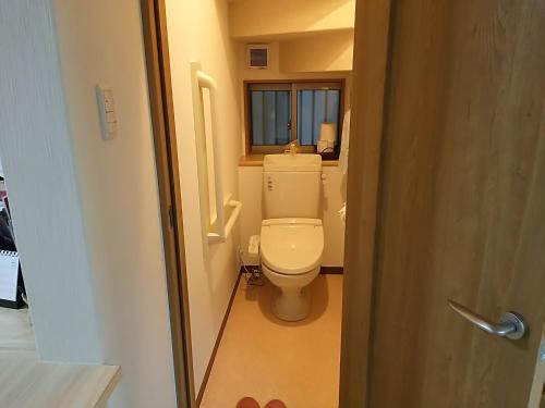 Kylpyhuone majoituspaikassa Guest House Aoi Nakamoto