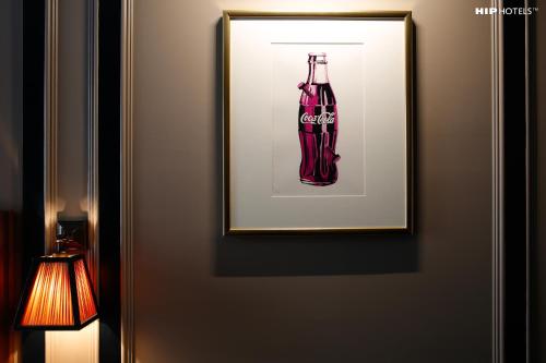 a picture of a cocacola bottle on a door at Mimi's Hotel Soho in London